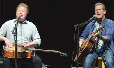  ?? The Associated Press ?? In this Jan. 15, 2014, file photo, Don Henley, left, and Glenn Frey of The Eagles perform on the History of the Eagles tour at the Forum in Los Angeles. The Eagles’ greatest hits album has surpassed Michael Jackson’s Thriller as the best-selling album of all-time. Hotel California is No. 3 on the best-selling list.