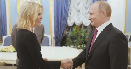  ?? AP PHOTO ?? ALL SMILES: Russian President Vladimir Putin greets NBC News’ Megyn Kelly prior to her interview with him in Moscow. Putin said alleged Russian inteferenc­e in the U.S. election wasn’t tied to his government.