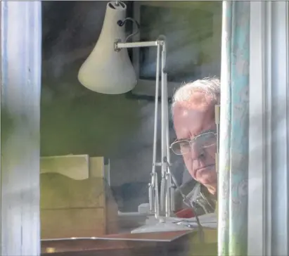  ??  ?? WOUNDED: Cardinal Keith O’Brien studies papers in the office of his official residence in Edinburgh yesterday.