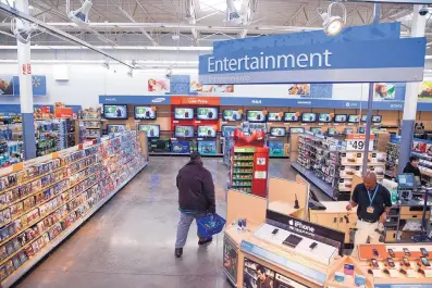  ?? ASSOCIATED PRESS ?? This is an entertainm­ent section of a Walmart store in Virginia. All Walmart stores have been told to take down all signs and displays that depict violence following a mass shooting at its El Paso, Texas, location that left 22 people dead.