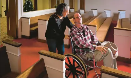  ?? JOHN AMIS/AP 2022 ?? Laura Lamb and her husband, Jerry, make their way into the sanctuary of Camden First United Methodist Church in Camden, Tennessee.