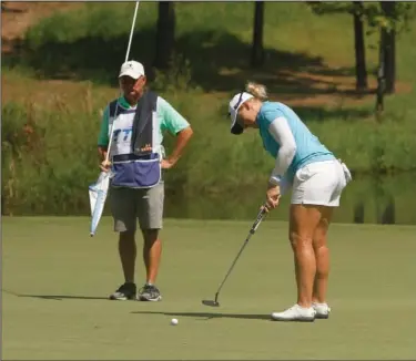  ?? Terrance Armstard/News-Times ?? Get in the hole: A.J. Newell, of Tampa,Florida, hits a putt Saturday during the second round of the Murphy USA El Dorado Shootout at Mystic Creek. South Korea's Hyemin Kim shot 70 on Saturday to grab a two-stroke lead with a 138, heading into today's final round. First-round leader Casey Danielson shot 73 and sits at 140 followed by Elizabeth Szokol (143), Sandy Choi (143) and Dottie Ardina (143).