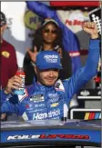  ?? (AP/Ian Maule) ?? Kyle Larson celebrates March 3 after winning a NASCAR Cup Series race at Las Vegas Motor Speedway in Las Vegas. The 2021 NASCAR Cup champion is going to attempt to complete the Memorial Day weekend double — 1,100 miles of racing in Indianapol­is and Charlotte, N.C., on the same day.