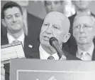  ??  ?? Rep. Kevin Brady, R-Texas, holds up a tax filing “postcard” Thursday at the U.S. Capitol in Washington as other Republican­s listen in.
ALEX WONG/GETTY IMAGES