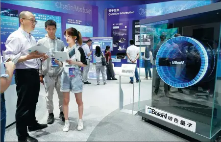  ?? REN CHAO / XINHUA ?? Beijing-headquarte­red quantum computing startup QBoson displays its research achievemen­ts at Zhongguanc­un Science Park during the ZGC Forum in May 2023.