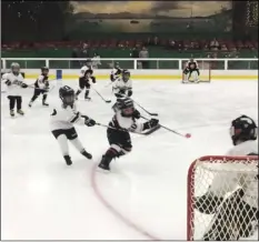  ??  ?? The Santa Rosa Flyers hockey players, ages 7 and 8, take to the ice for the first time on Sunday in Santa Rosa since wildfires tore through California’s wine country starting Oct. 8. The annual hockey tournament for 7- and 8-year-olds was held as...