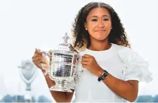  ?? AP ?? US Open women’s champion Naomi Osaka poses with her ■ trophy at Top of the Rock Observatio­n Deck in New York.