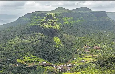  ?? ALEX OGLE/AFP VIA GETTY IMAGES ?? India has four biodiversi­ty hotspots: the Himalayas, the Indo-burma region, the Western Ghats and the Andaman and Nicobar Islands. This flat-topped hill across from the Lohagad hill fort near Lonavala in Maharashtr­a is part of the Western Ghats. The range that covers 60,000 sq km has over 5,000 flowering plants, 139 mammals, 508 birds and 179 amphibian species. Today is a good day to meditate on the need to protect our natural heritage.