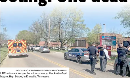  ?? KNOXVILLE POLICE DEPARTMENT/AGENCE FRANCE-PRESSE ?? LAW enforcers secure the crime scene at the Austin-East Magnet High School, in Knoxville, Tennessee.