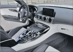  ??  ?? The interior of the Mercedes-AMG GT S Coupe feels considerab­ly less mainstream that its less-expensive competitor.