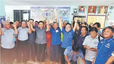  ??  ?? Uggah (front, fifth right), Salang on his right and Mawan (front, third left) join the longhouse chieftains in a group photo during the session at Rumah George.