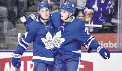  ?? CP PHOTO ?? Toronto Maple Leafs’ William Nylander, right, celebrates his goal against the Buffalo Sabres with teammate Auston Matthews during NHL action in Toronto on April 2.