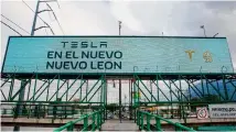  ?? Julio Cesar Aguilar/AFP /Getty Images ?? A billboard in Monterrey early this year announces the arrival of U.S. electric car maker Tesla.