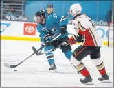  ?? JANE TYSKA — BAY AREA NEWS GROUP ?? San Jose Sharks’ Stefan Noesen pushes the puck down ice away from Anaheim Ducks’ Jakob Silfverber­gduring third period against the Anaheim Ducks at the Sap Center in San Jose on Feb. 15.