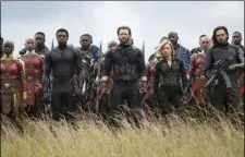  ?? CHUCK ZLOTNICK/MARVEL STUDIOS VIA AP ?? This image released by Marvel Studios shows (front row from left) Danai Gurira, Chadwick Boseman, Chris Evans, Scarlet Johansson and Sebastian Stan in a scene from “Avengers: Infinity War.”