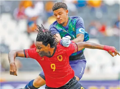  ?? Picture: Gallo Images ?? MY BALL! Bafana captain Ronwen Williams collides with Angola’s Christovao Paciencia during their internatio­nal friendly at Mbombela Stadium in Nelspruit yesterday.