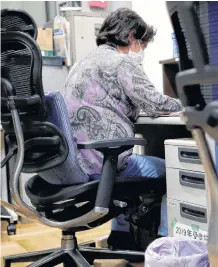  ?? REUTERS ?? A volunteer handles an incoming call at the Tokyo Befriender­s call centre, a Tokyo’s suicide hotline center, during the spread of COVID-19, in Tokyo, Japan on May 26.