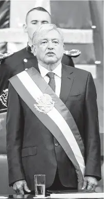  ?? Eduardo Verdugo / Associated Press ?? Mexico’s new President Andres Manuel López Obrador sings the national anthem at the end of his inaugural ceremony at the National Congress in Mexico City on Saturday.