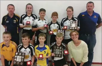  ??  ?? Boys and girls from the finals in Coolgreany with county officials.