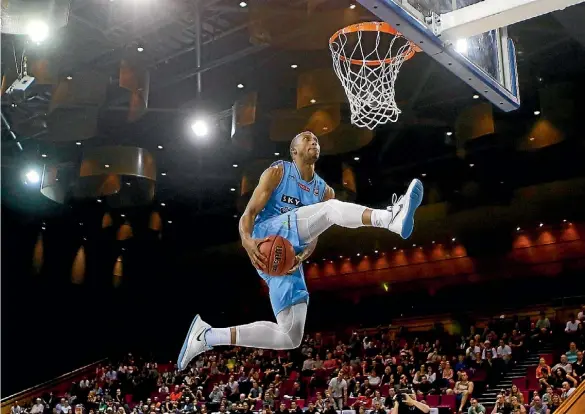  ?? PHOTO: CHRIS HYDE/ GETTY IMAGES ?? Akil Mitchell of the New Zealand Breakers dunks during the dunk contest during the Australian Basketball Challenge.