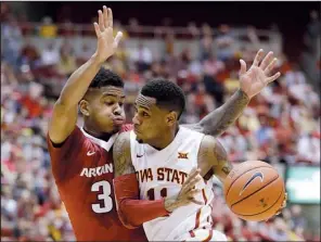  ?? AP/CHARLIE NEIBERGALL ?? Arkansas guard Anton Beard (left) tries to defend Iowa State guard Monte Morris as he drives to the basket during Thursday’s game. Coach Mike Anderson was not pleased with his team’s defensive effort, calling it “soft” Friday.