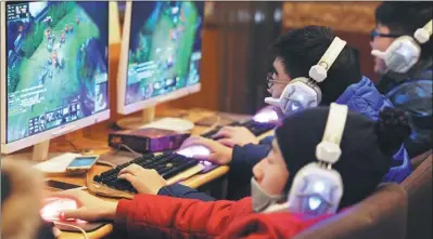  ?? ZHAO YADAN / FOR CHINA DAILY ?? Addiction to online gaming among children and teenagers is increasing­ly becoming a common concern for parents and educators. Experts are calling for more protection for young internet users from online risks.