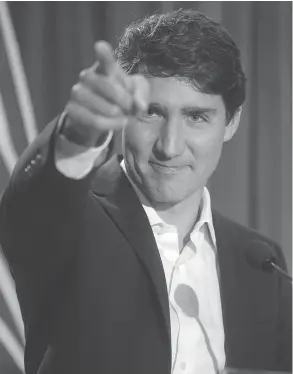  ?? DARRYL DYCK / THE CANADIAN PRESS ?? Based on his latest poll numbers, Justin Trudeau appears to have built an immune system that makes him resistant to a host of political pathogens, John Ivison writes.