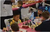  ??  ?? BATTLE ZONE: Junior chess combatants deep in thought as they attempt to out manoeuvre each other.