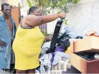  ?? NICHOLAS NUNES PHOTOS ?? Pauline Edwards, one of the nine victims of a blaze in Standpipe, St Andrew, is thankful no lives were lost in yesterday’s fire.