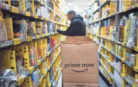  ?? MARK LENNIHAN/AP ?? More than 1 million items across the entire Amazon site, both those sold by Amazon and by third-party sellers, will be discounted over the course of the Prime Day promotion.