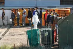  ?? BORJA SUAREZ/REUTERS ?? Migrants are seen in a military camp in Las Palmas, Spain, on November 20, 2020.