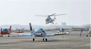  ?? ?? A helicopter lands at an airport in Jintang County, Sichuan Province in southwest China, on 24 December 2023, the day when two low-altitude air routes linking Jintang and other regions in the province opened