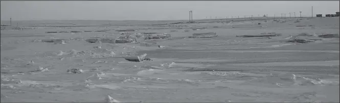  ?? Photo by Nikolai Ivanoff ?? NOME RIVER— The Nome river is frozen solid on December 12.