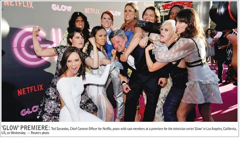  ??  ?? US, on Wednesday. — Reuters photo Ted Sarandos, Chief Content Officer for Netflix, poses with cast members at a premiere for the television series ‘Glow’ in Los Angeles, California,