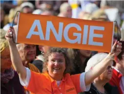  ?? ANDREAS ARNOLD/AFP/GETTY IMAGES ?? An Angela Merkel supporter at an election campaign rally for the Christian Democratic Union’s (CDU) in Mainz, Germany.