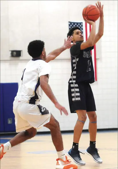  ?? File photos by Ernest A. Brown ?? Two of the best point guards in the state, Shea sophomore Erickson Bans (2, above) and Cumberland junior Tyler Kolek (11, right) return to lead their respective teams. Bans is back after garnering All-State honors as the Raiders advanced all the way to...