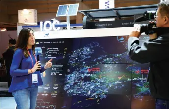  ??  ?? Reporters cover Chinese technology giant Huawei’s smart city solution at the Smart City Expo World Congress in Barcelona, Spain, on November 14, 2017