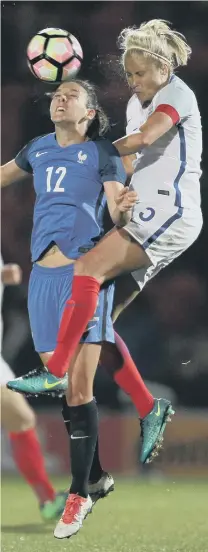  ??  ?? England Ladies captain Steph Houghton, from South Hetton, beats France’s Clarisse Le Bihan to this ball in last night’s goalless internatio­nal friendly draw at Doncaster. Houghton was joined in the team by five fellow ex-Sunderland Ladies players, in...