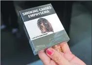  ?? JASON REED / REUTERS ?? Restrictiv­e packaging for cigarettes sold in Australia.