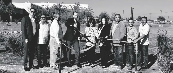  ?? PHOTO COURTESY ICAPCD ?? Members from ICOE, ICAPDC and the County of Imperial Board of Supervisor­s line up as County Superinten­dent of Schools, Todd Finnell (left of center, with scissors), cuts the ribbon in celebratio­n of the ICOE Urban Greening Project completion, on Monday, Oct. 17, in El Centro.