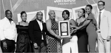  ?? PHOTO BY ASHLEY ANGUIN ?? Tai Flora Luxe’s Jessica Riley (second right) presents the Best Eco/Sustainabl­e Resort Award to Jamaica Inn’s team. At right is Kyle Mais.