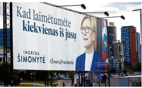  ??  ?? In the running: Simonyte’s campaign placard is seen in Vilnius, Lithuania. — Reuters