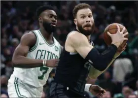  ?? MICHAEL DWYER - THE ASSOCIATED PRESS ?? This Feb. 13, 2019, file photo shows Boston Celtics’ Jaylen Brown (7) defending against Detroit Pistons’ Blake Griffin (23) during the second half of an NBA basketball game in Boston.