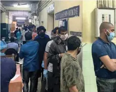  ?? AFP; Blood Donors Kerala ?? Top, wreckage of the Air India Express jet at Kozhikode airport in Kerala. Above, volunteers queue at hospitals in Kozhikode and Mallapuram to give blood after the crash