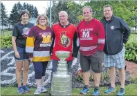  ?? MARIE MCCARTHY PHOTO ?? Journal Pioneer reporter Eric McCarthy, center, was treated to a special visit with the Stanley Cup Sunday evening. Members of the O’Leary Kraft Hockeyvill­e Committee brought the cup to his Bloomfield home along with an Ottawa Senators signed jersey....