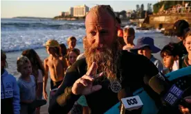  ?? Photograph: Saeed Khan/AFP/Getty Images ?? Australian former profession­al surfer Blake Johnston has broken the record for the world's longest surf session at Cronulla beach.