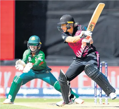 ??  ?? ABOVE
New Zealand’s Sophie Devine, right, plays a shot against Bangladesh in the T20 World Cup in Melbourne yesterday.