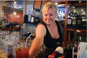  ?? Gazette file photo by Junius Stone ?? ■ Jamie Reynolds serves up a spicy Bloody Mary at the Railyard Saloon.