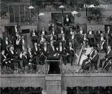  ??  ?? From band to orchestra: (right) Dan Godfrey with the Bournemout­h Municipal Orchestra circa 1910; (below) Godfrey’s father, the distinguis­hed bandmaster Daniel Godfrey Snr, as caricature­d by Spy in Vanity Fair, 1888