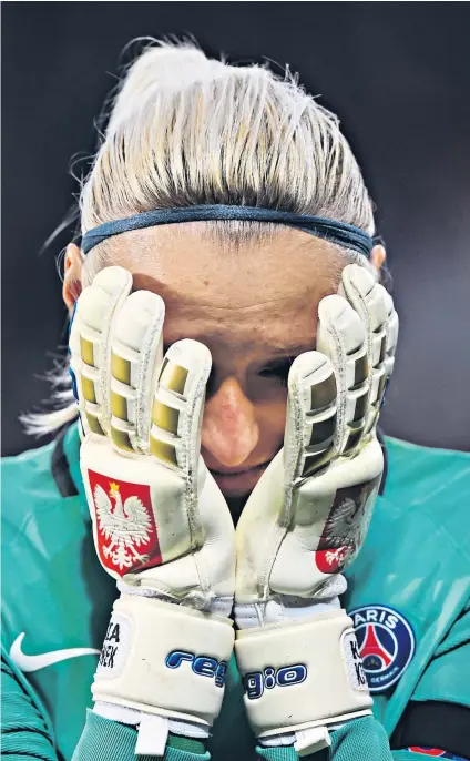  ?? ?? Agony: Paris St-germain keeper Katarzyna Kiedrzynek is distraught after missing her penalty in the 2017 Champions League final shoot-out